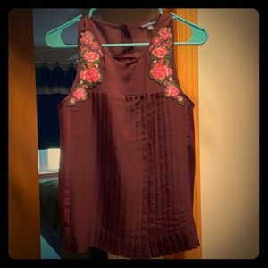 Never worn, pleated sleeveless blouse
